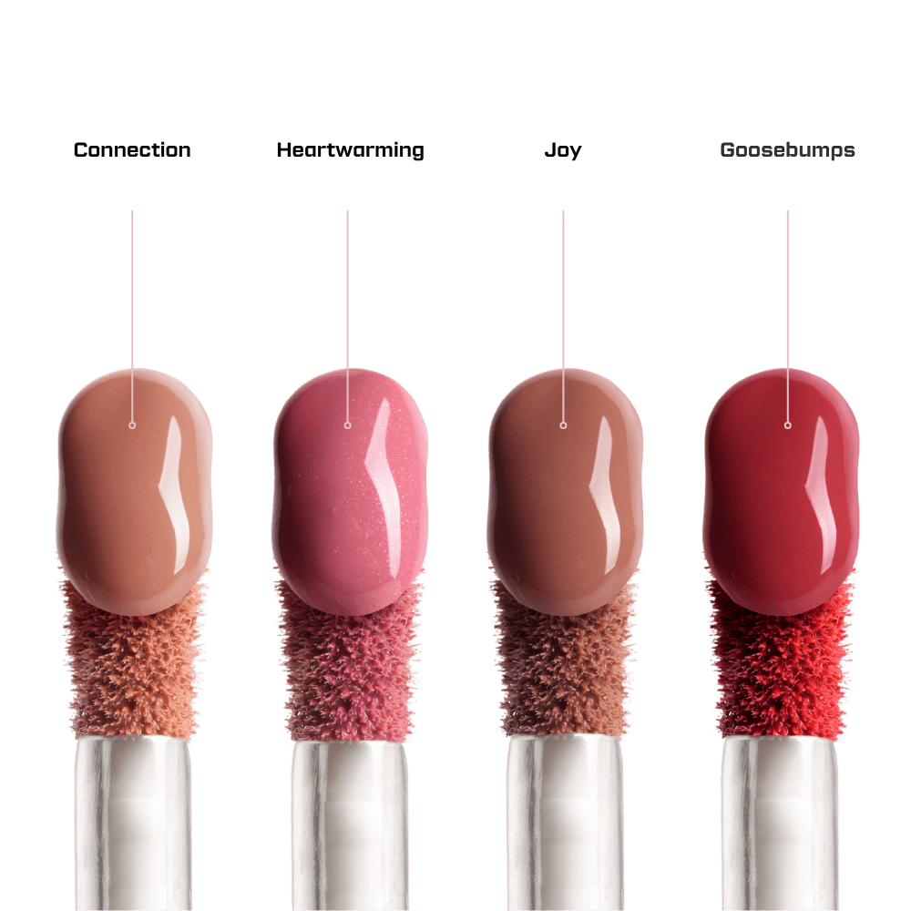 Four lip gloss applicators with different shades