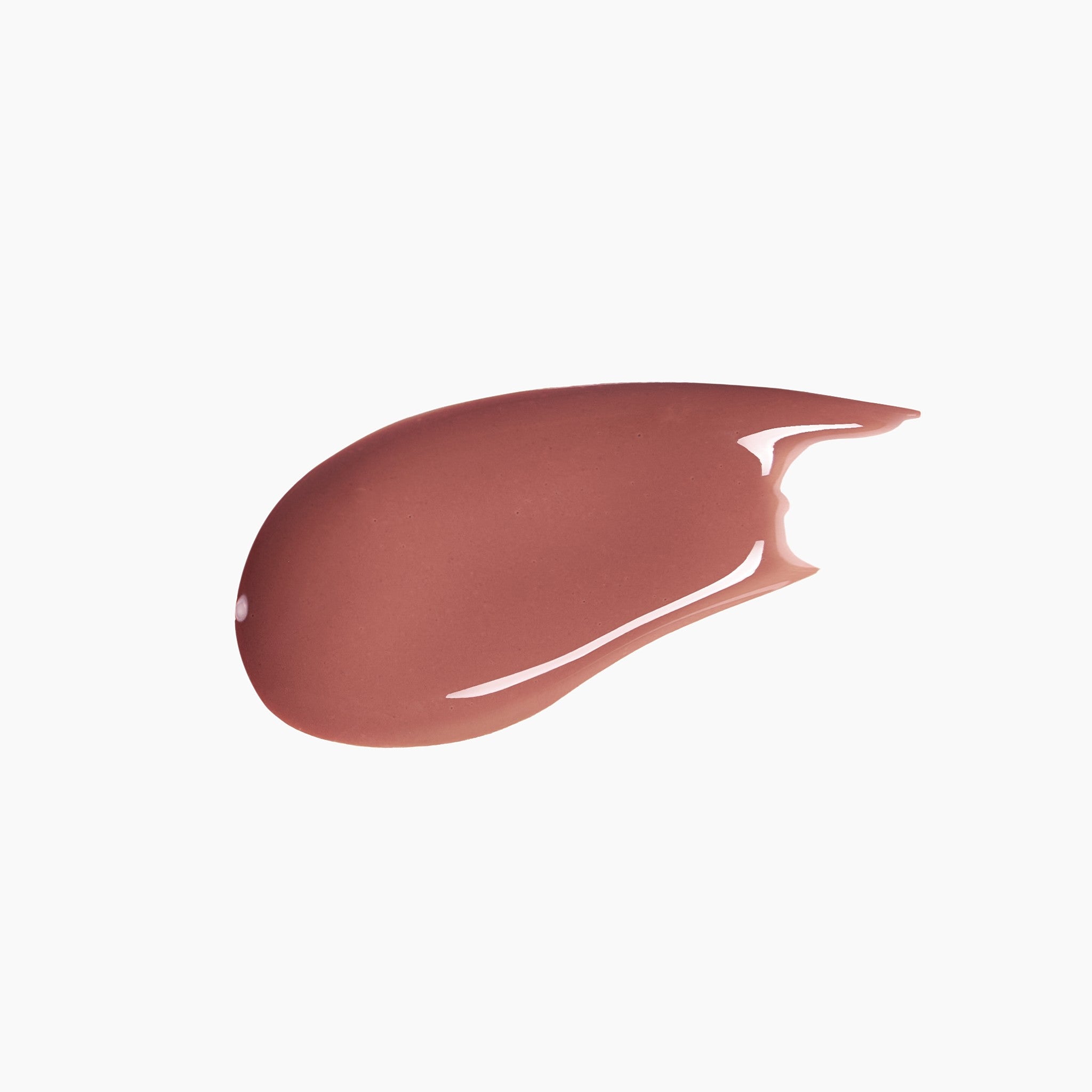 Nude-colored lip gloss swatch on a white background